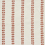 Detail of fabric in a playful ticking stripe print in rust on a white field.