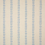 Detail of fabric in a playful ticking stripe print in light blue on a tan field.
