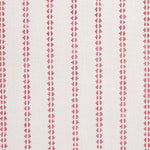 Detail of fabric in a playful ticking stripe print in pink on a white field.