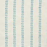Detail of fabric in a playful ticking stripe print in turquoise on a cream field.
