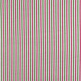 Detail of fabric in a small-scale stripe print in green and fuchsia on a greige field.