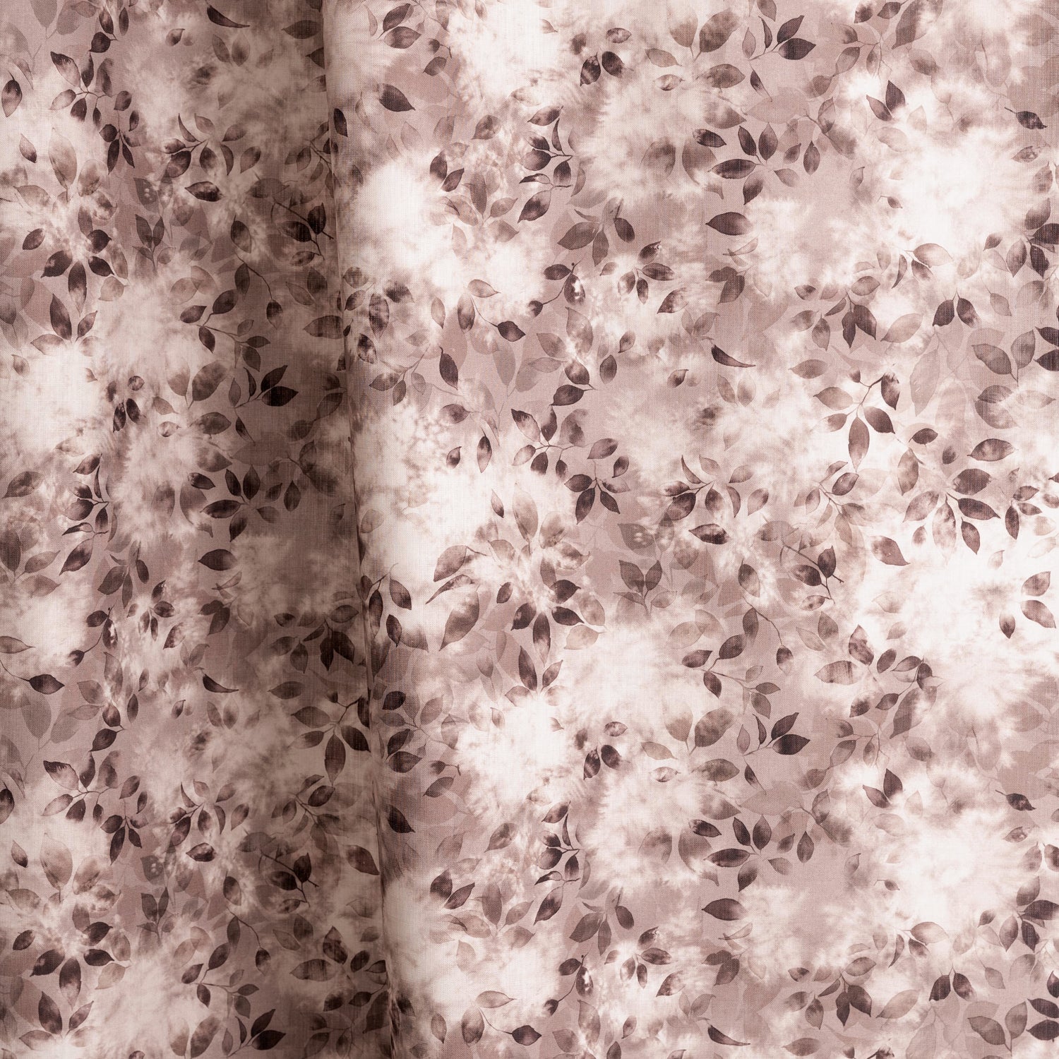 Gently draped fabric in a painterly leaf print in shades of wine purple and mauve with a mottled white overlay.