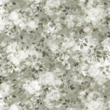 Detail of fabric in a painterly leaf print in shades of grey-green with a mottled white overlay.