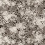 Detail of wallpaper in a painterly leaf print in shades of warm charcoal grey with a mottled white overlay.