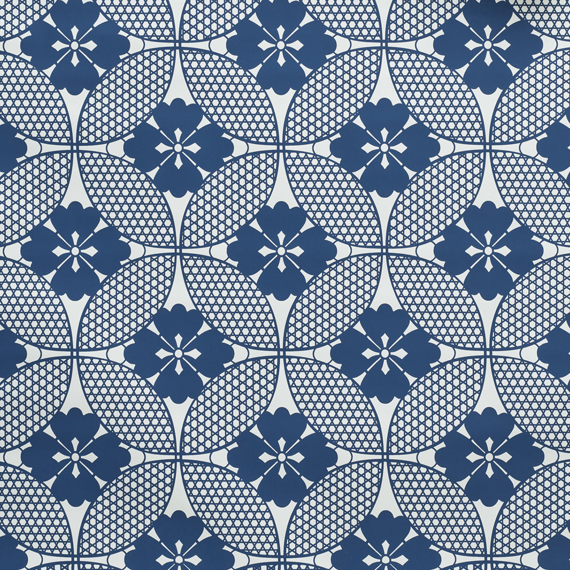 A close-up wallpaper featuring a Japanese inspired floral lattice design in navy blue on white. 