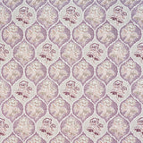 Detail of fabric in a floral damask print in shades of purple, cream and tan on a cream field.