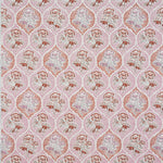 Detail of fabric in a floral damask print in shades of pink and red on a cream field.