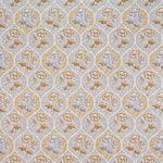 Detail of fabric in a floral damask print in shades of gray and mustard on a cream field.