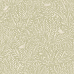 Detail of fabric in a playful bird and leaf print in cream on a light green field.