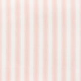 Detail of fabric in a textural speckled stripe print in dusty rose and cream.