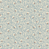 Wallpaper in a lyrical wildflower design in white with red accents on a blue field. 