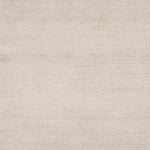 Broadloom carpet in a cut pile strié design in white.