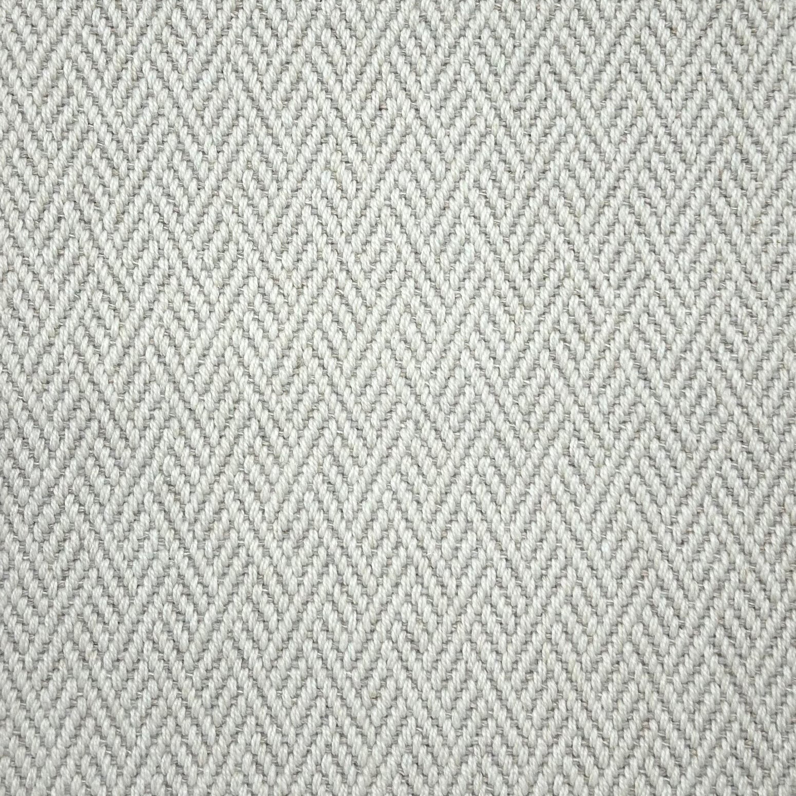 Broadloom carpet in a linear geometric design in light grey and white. 