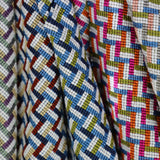 An array of woven stair step patterned fabrics.
