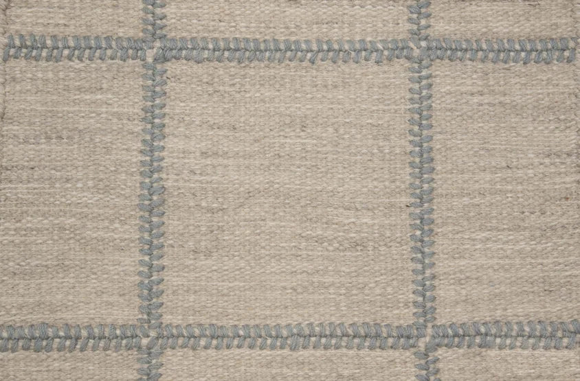 Broadloom carpet swatch in a checkered pattern in a grey blue design