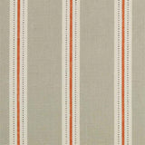Detail of fabric in a repeating stripe print in cream and burnt orange on a tan field.