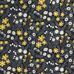 Detail of fabric in a small-scale floral print in white, gray and yellow on a dark gray field.
