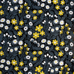 Detail of wallpaper in a small-scale floral print in white, gray and yellow on a black field.