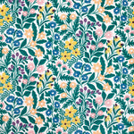 Detail of wallpaper in a small-scale floral print in green, yellow and coral on a white field.