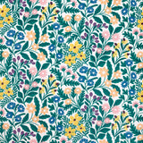 Detail of wallpaper in a small-scale floral print in green, yellow and coral on a white field.