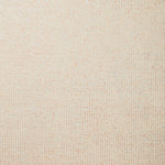 Detail of wallpaper in a paint splatter print in gold on a cream field.