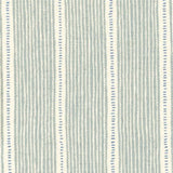 Detail of fabric in a repeating stripe and dash pattern in gray and blue on a cream field.