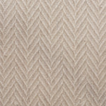 Broadloom carpet in a dimensional herringbone pattern in cream. 