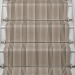 Striped flatweave runner in grey and black on white staircase