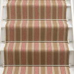 Striped flatweave runner in tan and red on white staircase