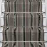 Striped flatweave runner in grey and black on white staircase