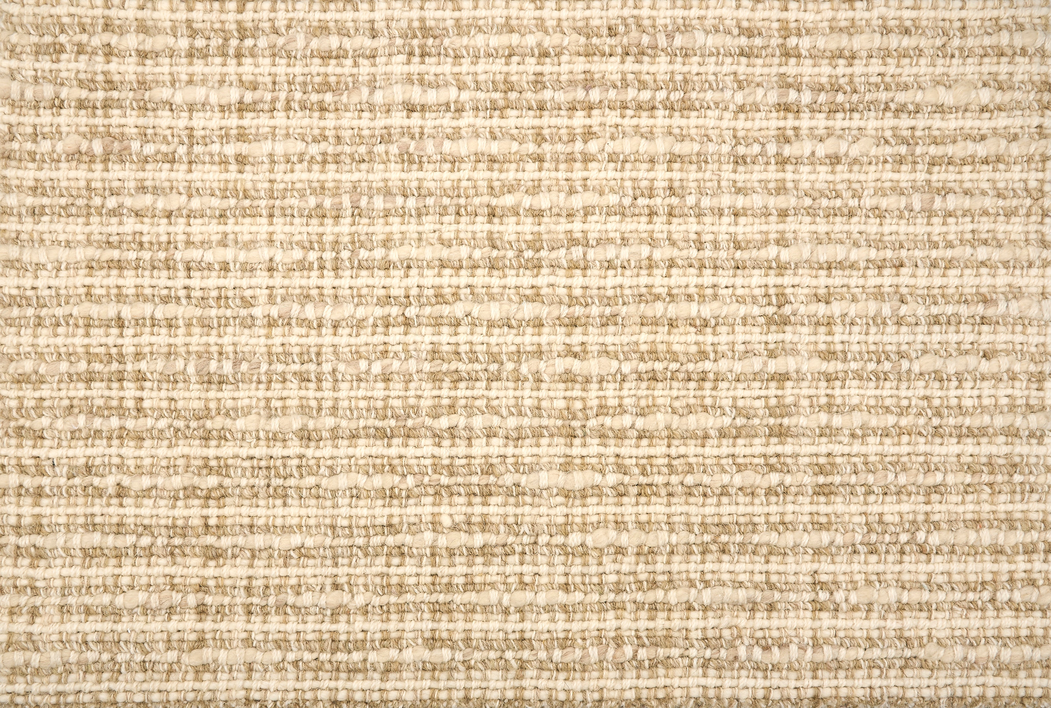 Broadloom carpet with textural weave in cream and beige. 