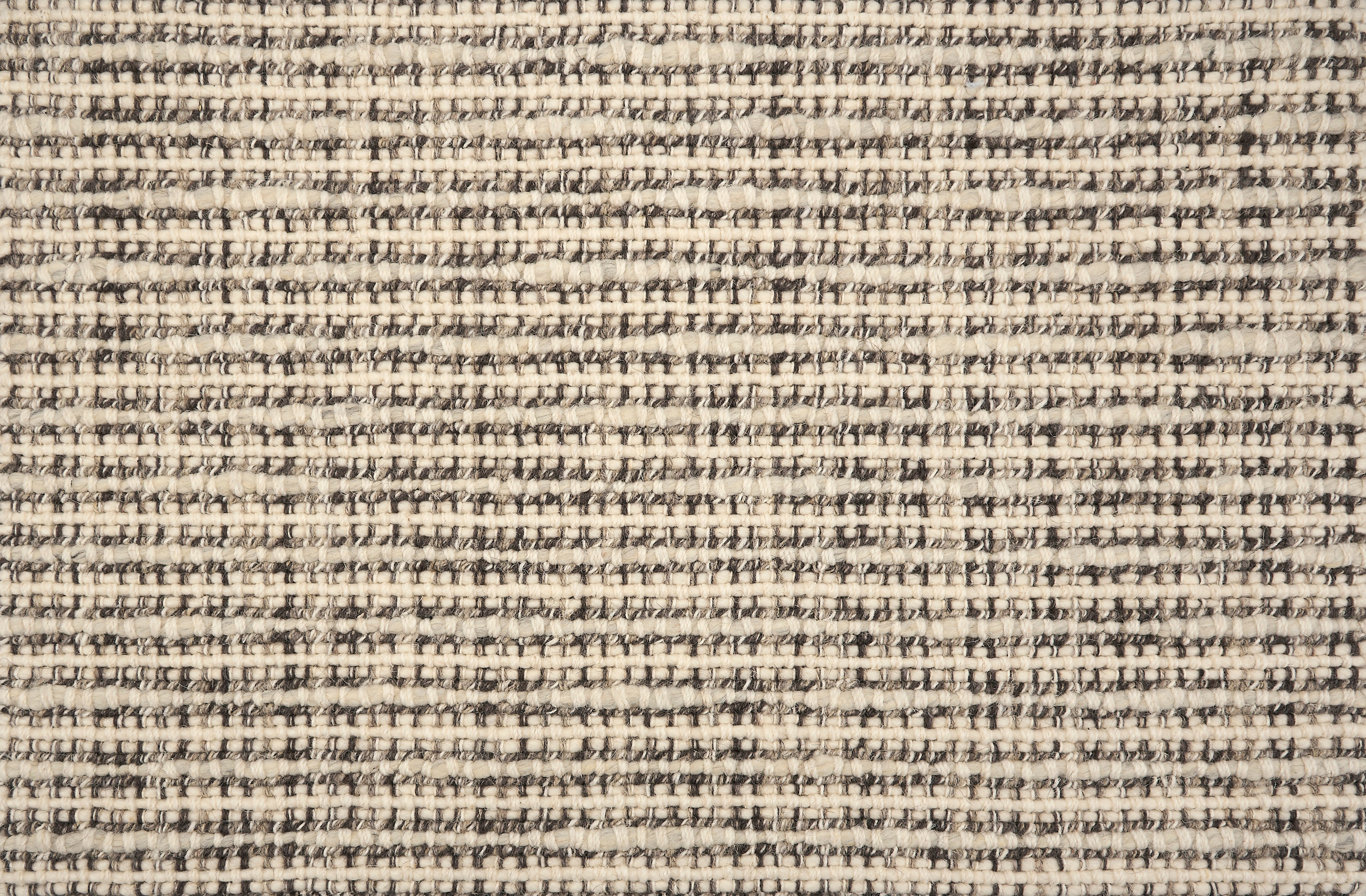 Broadloom carpet with textural weave in cream and dark brown. 