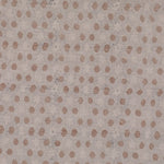 Detail of fabric in a star-shaped lattice print in tan and gray on a cream field.