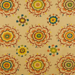 Detail of fabric in a floral paisley print in shades of blue, green and black on a cream field.