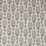 Detail of fabric in a small-scale floral print in shades of green, black and coral on a white field.