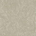Detail of wallpaper in a playful abstract sun print in white on a tan field.