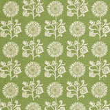 Detail of fabric in a repeating sunflower print in white on an olive field.