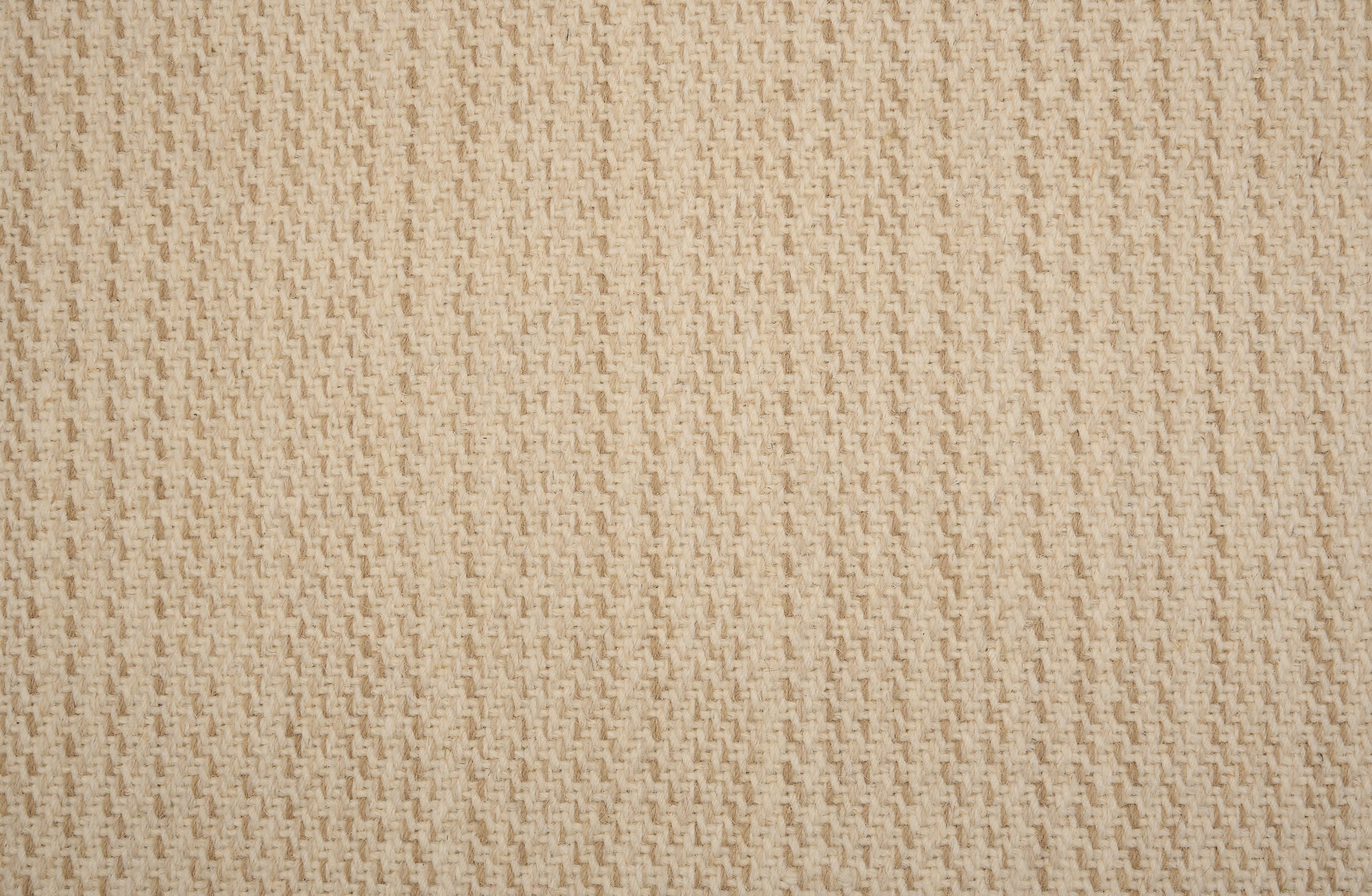 Broadloom carpet in a textural basketweave stripe in cream with stripes of ecru.