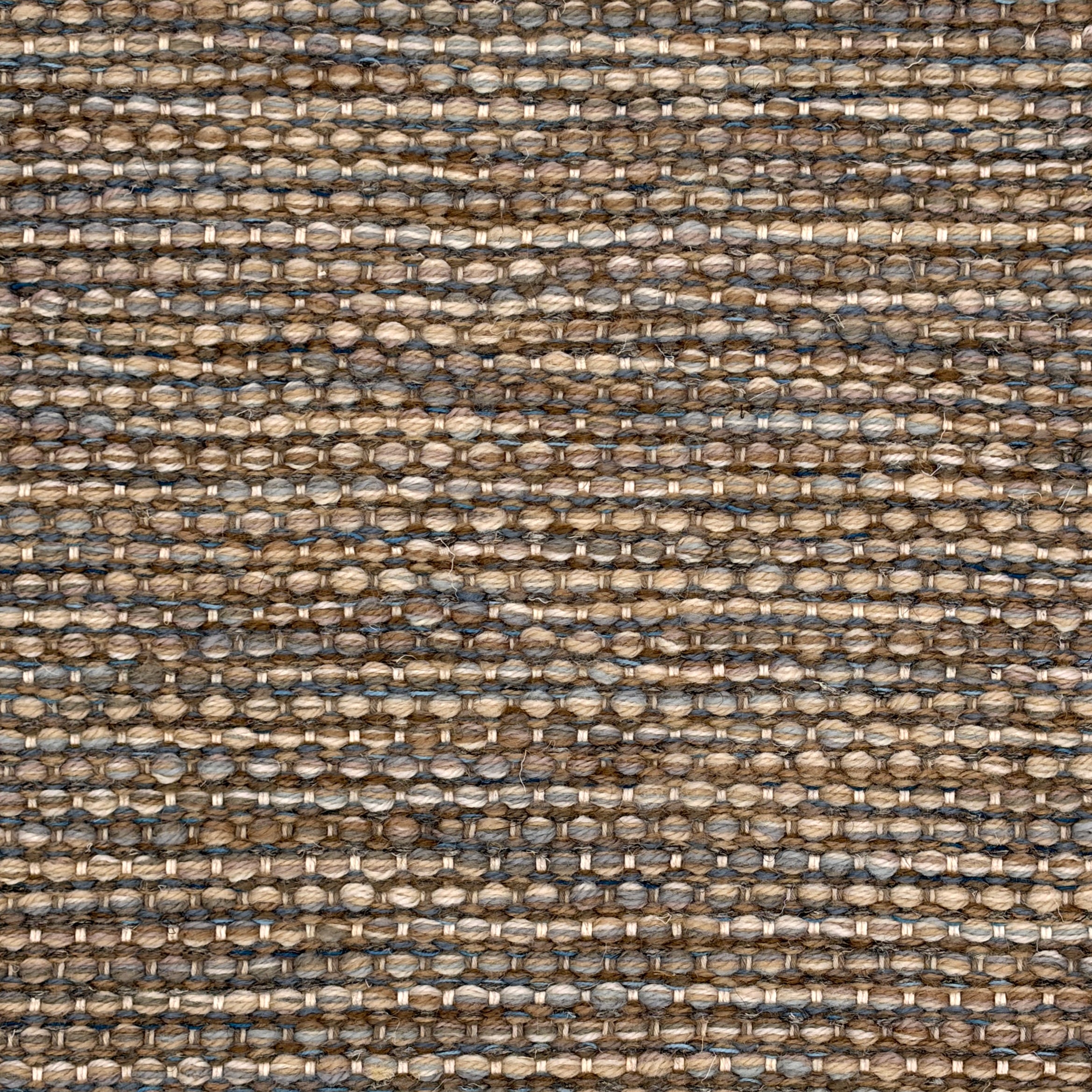 Handowoven rug in textural design in shades of brown and blue. 