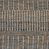 A close-up of a woven rug with a subtle stripe pattern in shades of light blue and tan. 