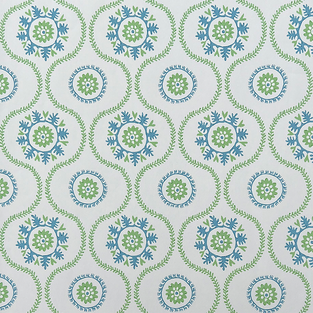 A lattice pattern made of scrolling vines with coral like emblems in green and blue on a white field. 