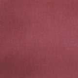 Detail of velvet fabric yardage in dusty red.