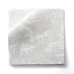 Fabric swatches in a playful wave print in white on a pale grey watercolor field.