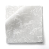 Fabric swatches in a playful wave print in white on a pale grey watercolor field.