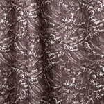 Playful wave print in white on a warm dark grey watercolor field.