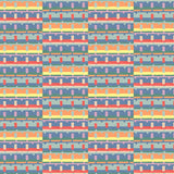 Detail of wallpaper in a playful geometric grid print in shades of purple, red, blue and orange.