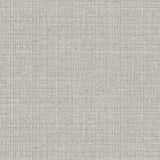 Detail of wallpaper in a textured tweed pattern in shades of gray. 
