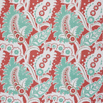 Detail of fabric in a botanical paisley print in shades of white, turquoise and green on a red field.