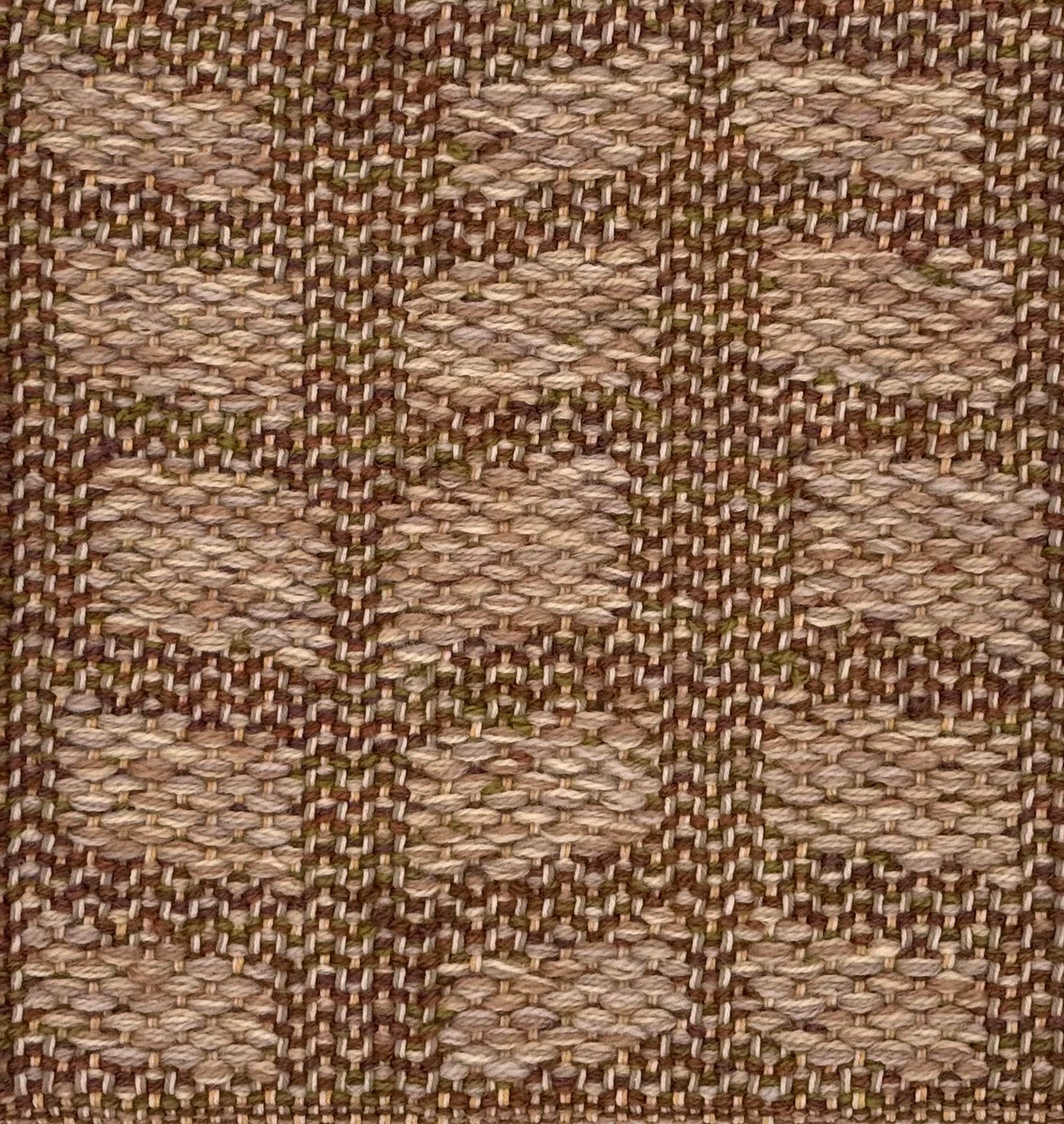A close-up of a woven wool rug with alternating rectangles in warm beige, tan, and brown tones.