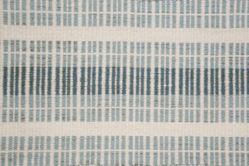 Broadloom carpet swatch in a stripe pattern in a blue design